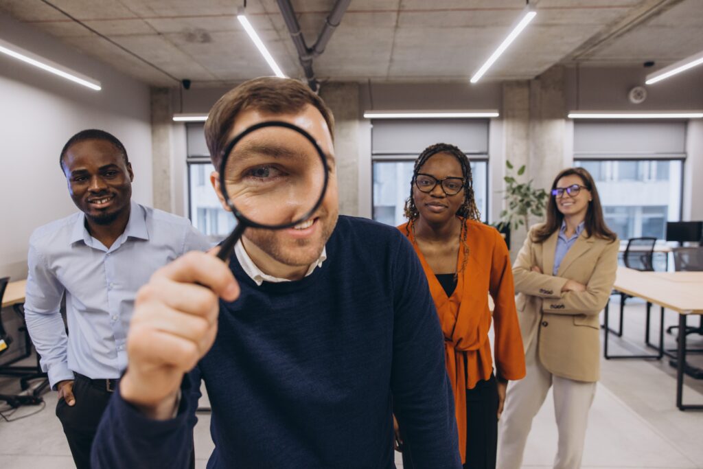 group looking into magnifying glass -christian worldview